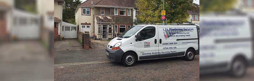 I.J's Plastering van outside a house